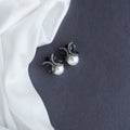 Black Plated Bow Design American Diamond Pearl Stud Earrings