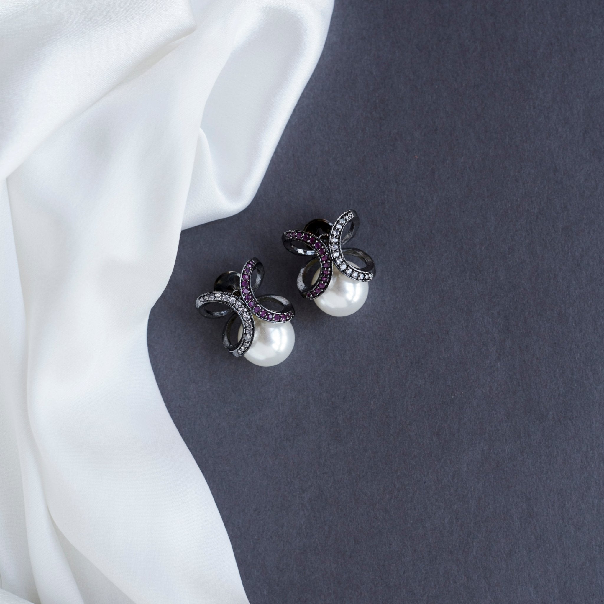 Black Plated Bow Design American Diamond Pearl Stud Earrings