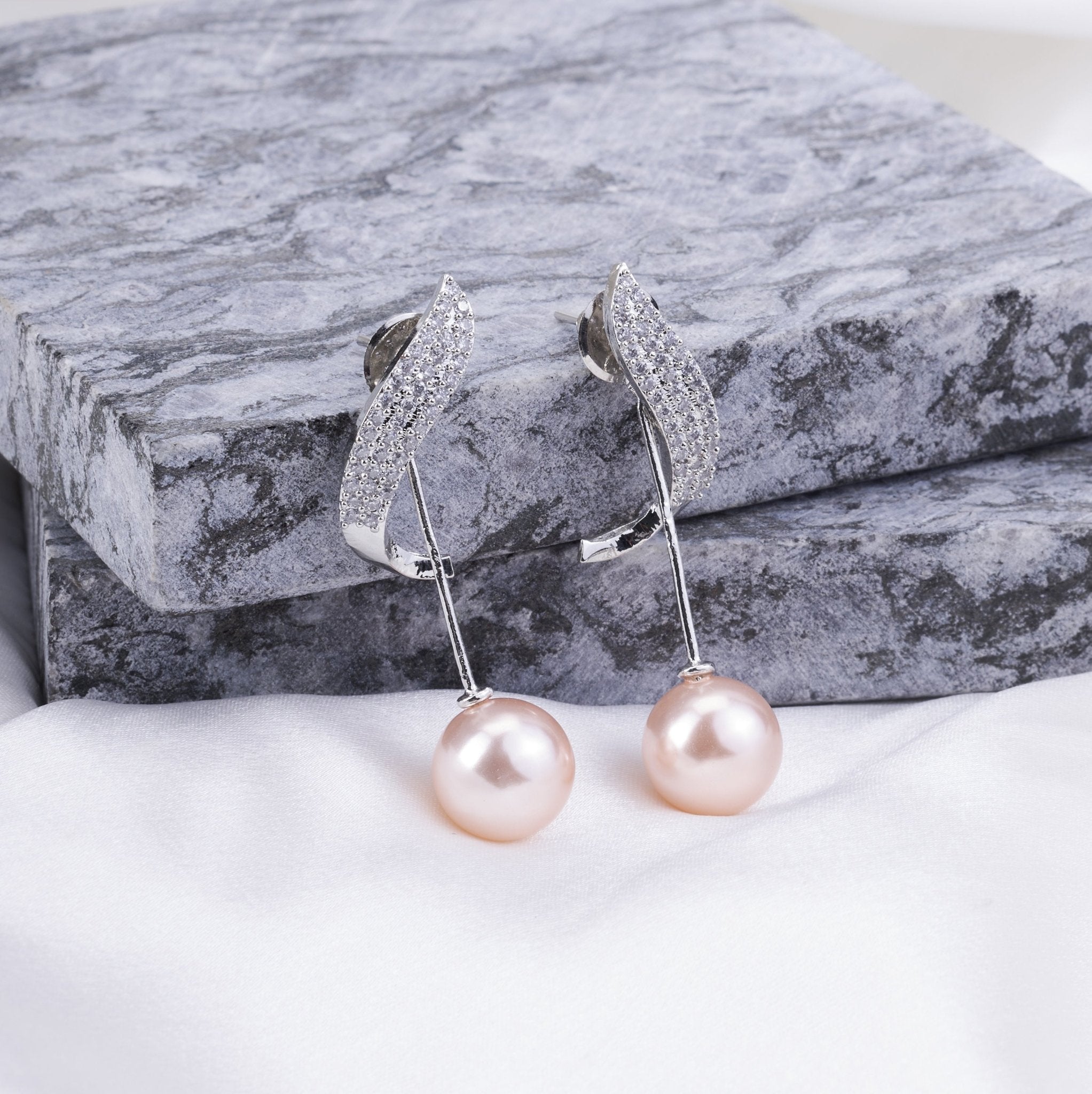 Rhodium Plated Curved Leaf Pearl Drop Earrings