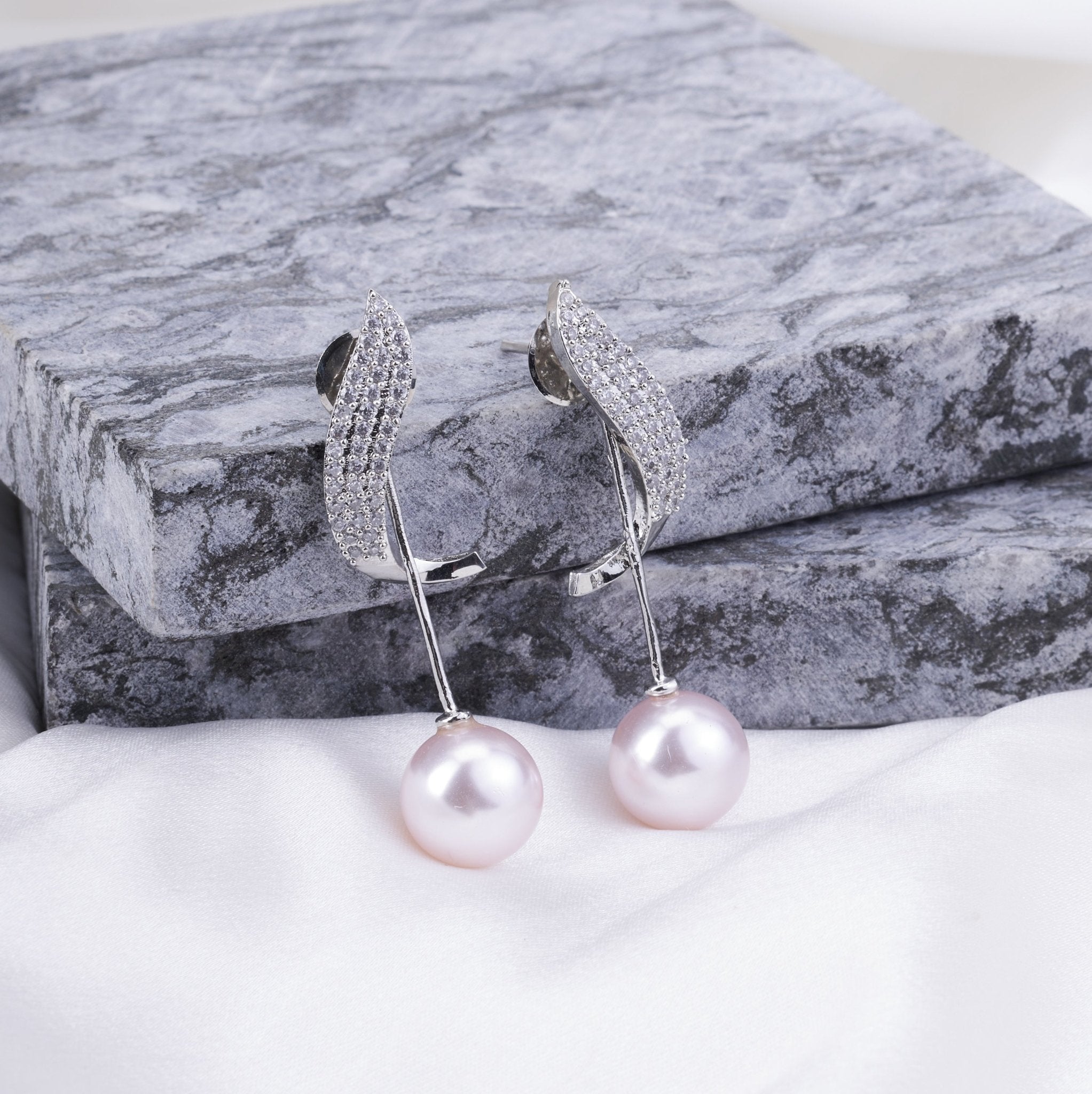 Rhodium Plated Curved Wave Pearl Drop Earrings